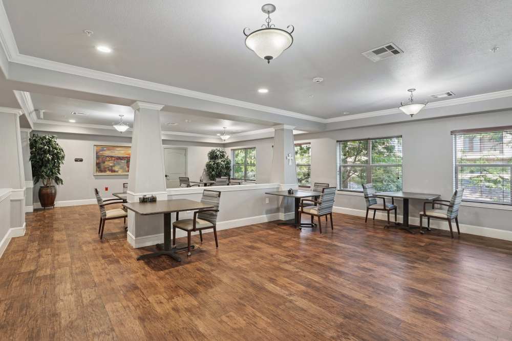 A spacious, well-lit dining room at Isle at Watercrest Mansfield in Mansfield, Texas