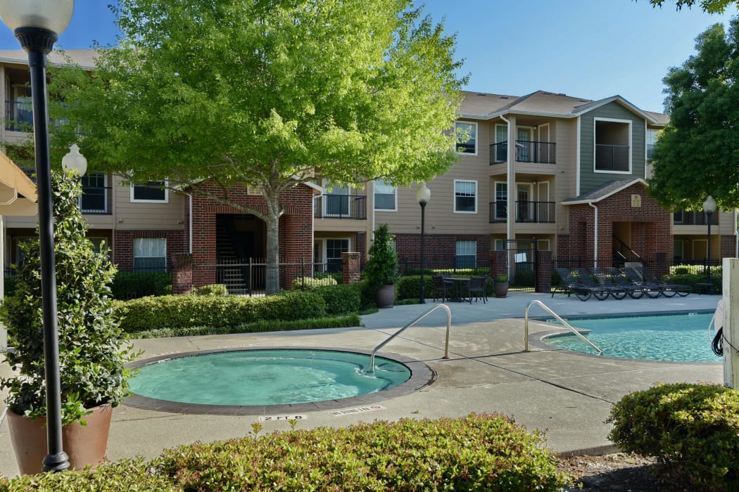 Hot tub and pool area at IMT At The Medical Center in Houston, TX