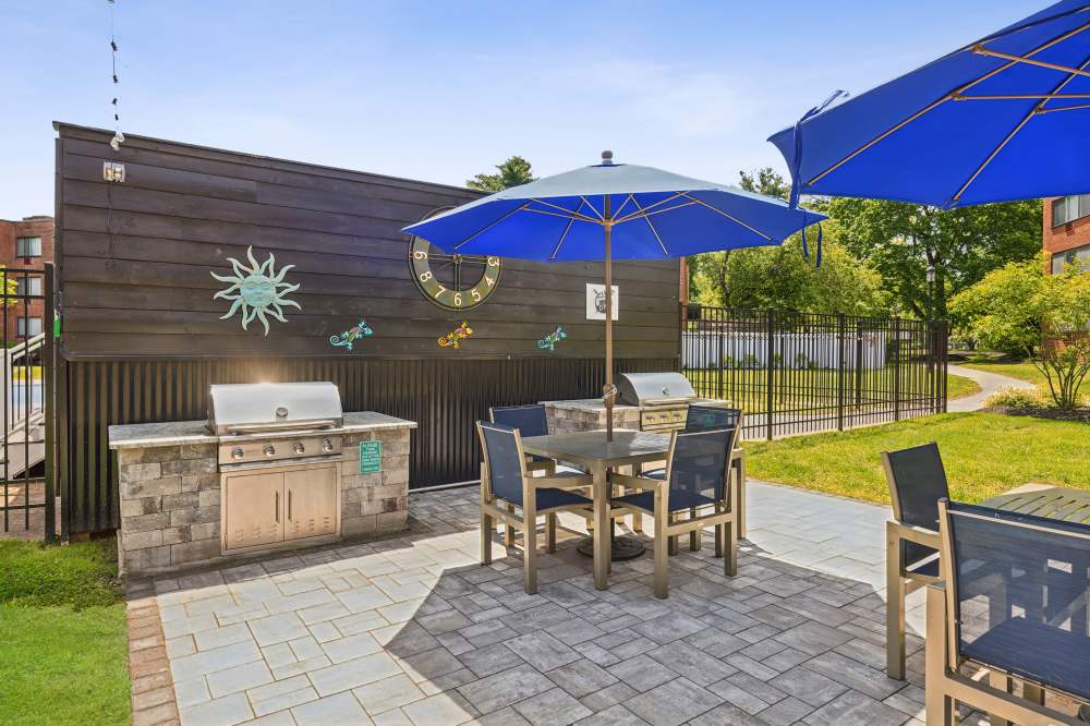 Grill and tables at Eagle Rock Apartments at West Hartford in West Hartford, Connecticut