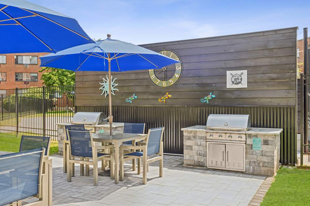 Grill and tables at Eagle Rock Apartments at West Hartford in West Hartford, Connecticut