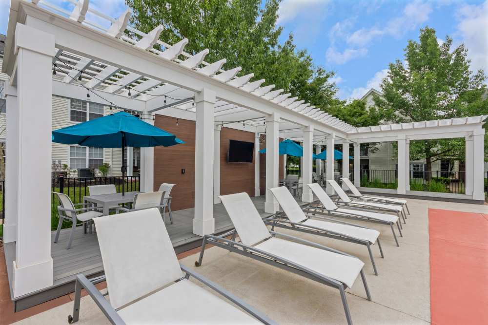 Lounge by the pool at Eagle Rock Apartments at Freehold in Freehold, New Jersey