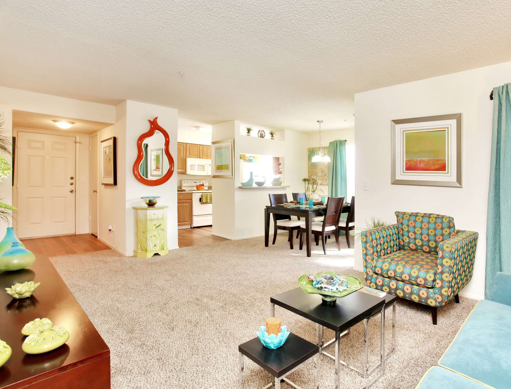 View of interior entryway, kitchen, and dining area from living room in model home at IMT Newport Colony in Casselberry, FL