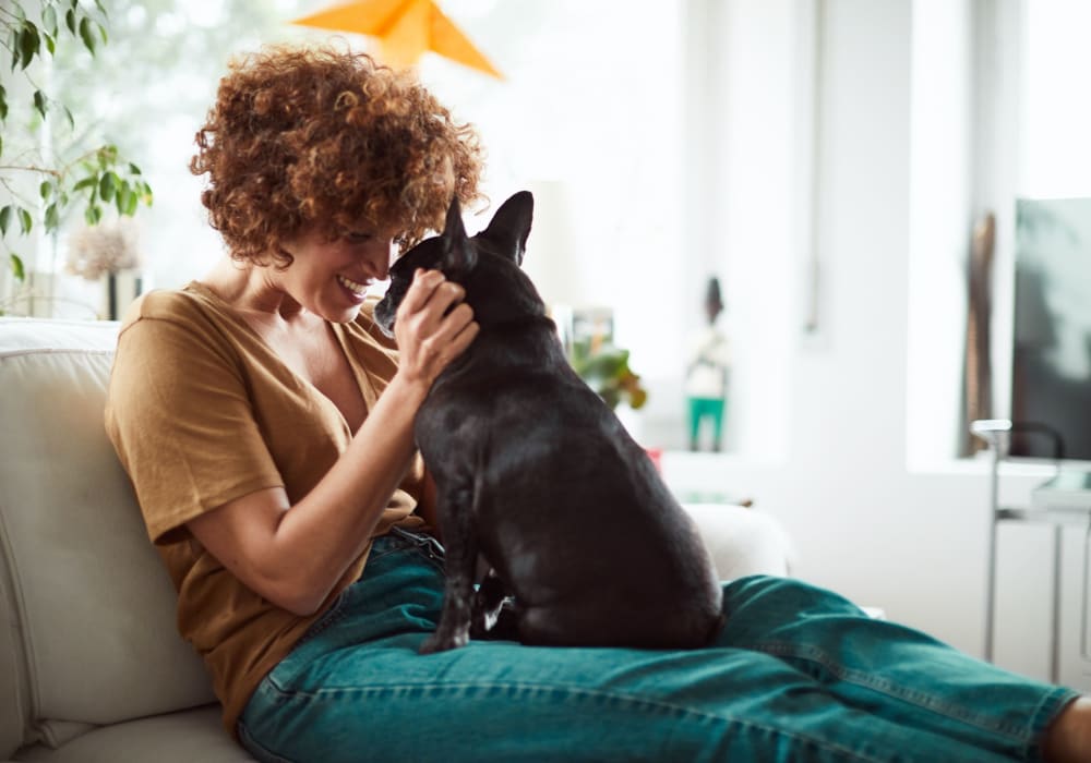 Resident hugging her dog near Deer Haven in Wenatchee, Washington