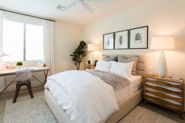 Well-decorated bedroom in model home at Avant at Fashion Center in Chandler, Arizona