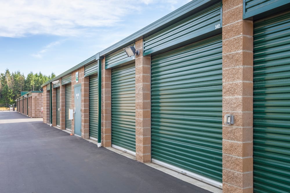 Exterior storage units with wide driveways at Emerald Heated Self Storage in Puyallup, Washington