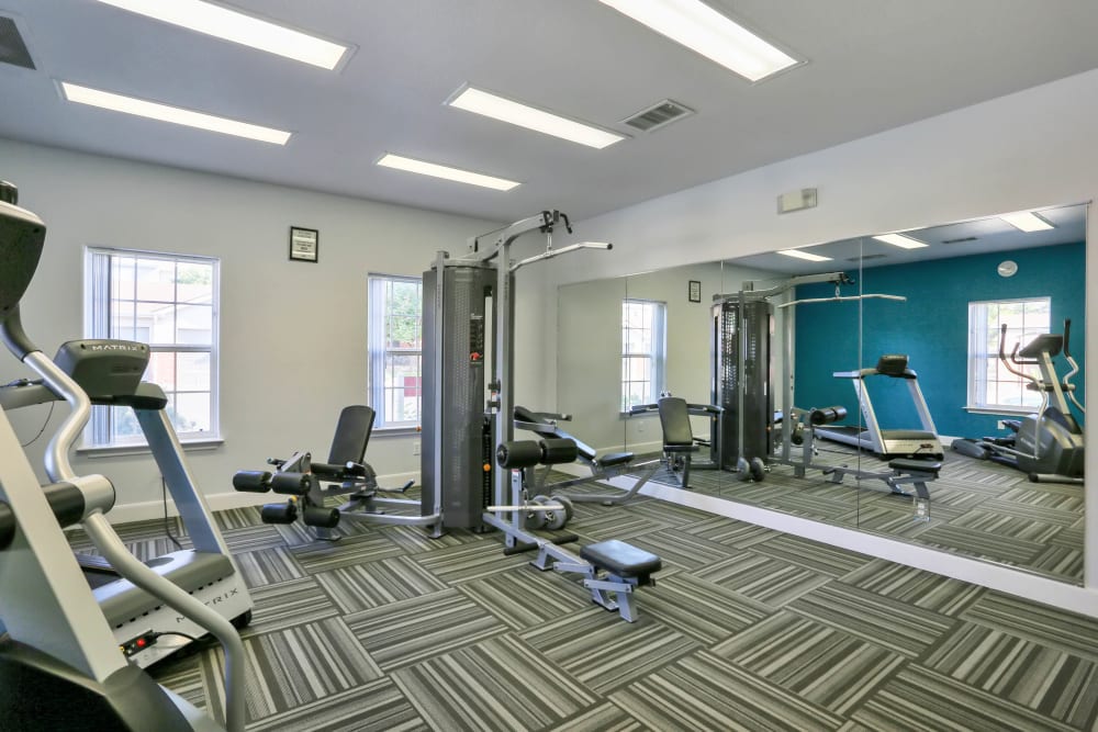 Fitness center at Country Ranch Apartments in Fort Collins, Colorado offers a variety of exercise equipment.