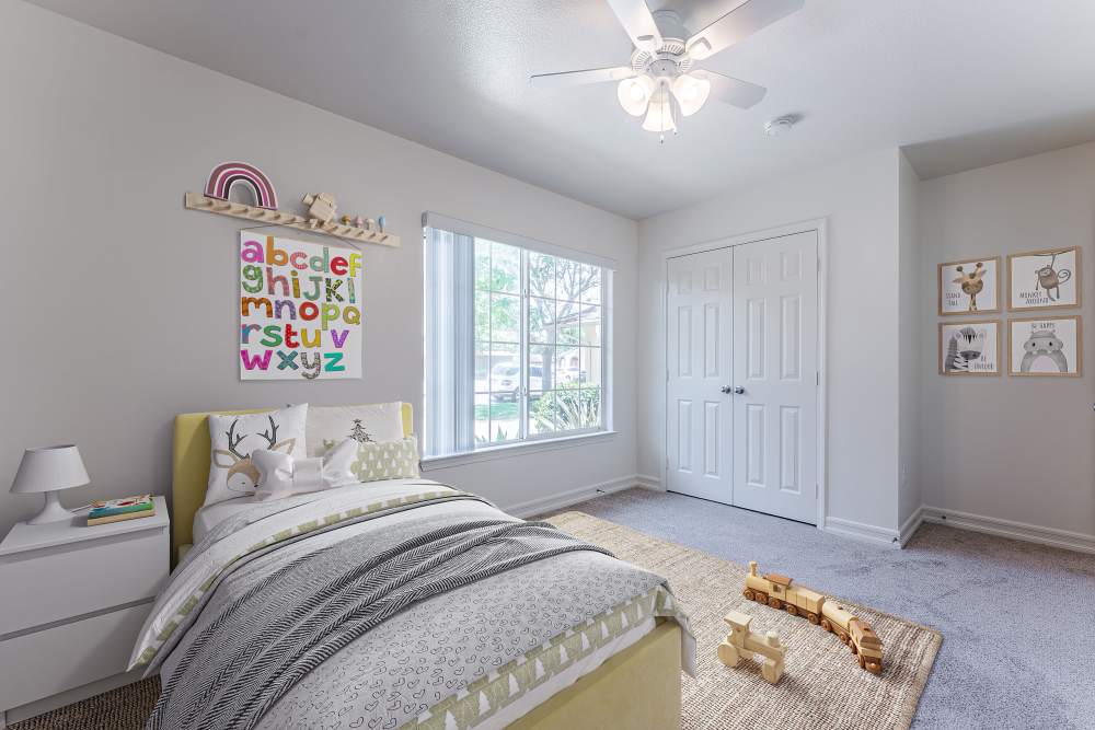 A bright bedroom in a home at Canyon View in San Diego, California