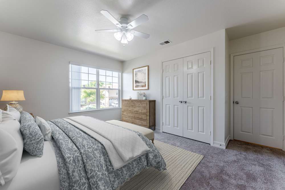 A bedroom with a ceiling fan at Canyon View in San Diego, California