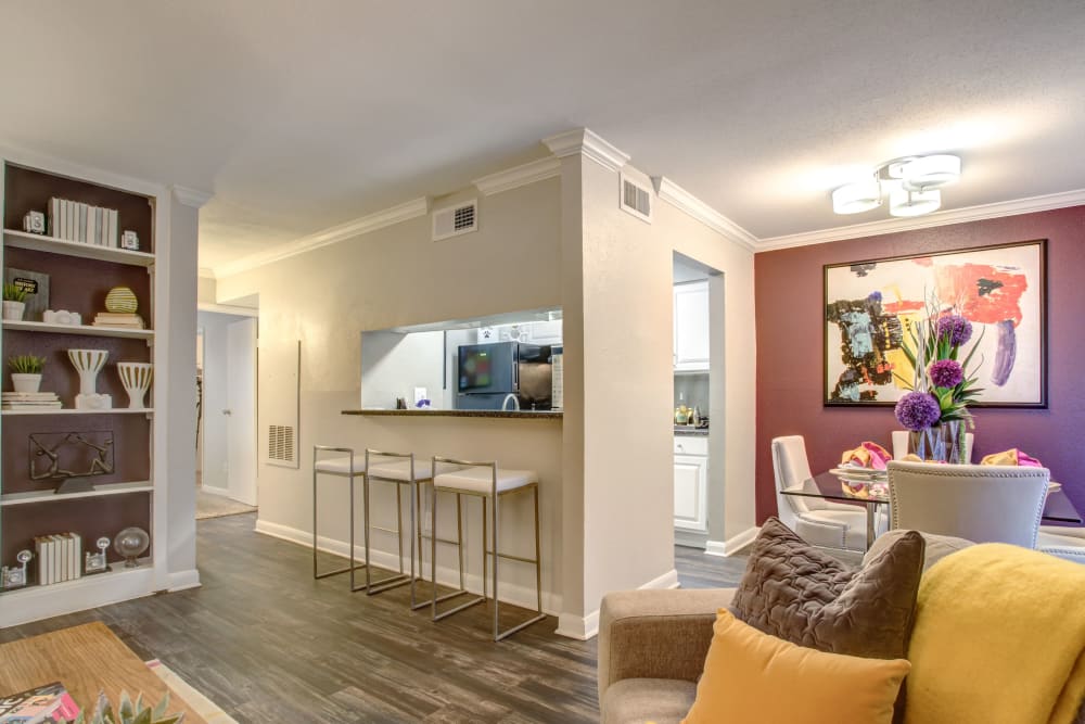Model living area and kitchen at 2400 Briarwest in Houston, Texas