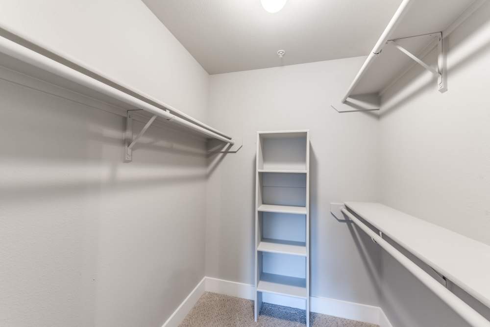 Walk-in closet with racks at The Biltmore in The Woodlands, Texas