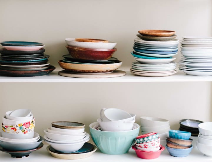 Organized plates and bowls on shelves