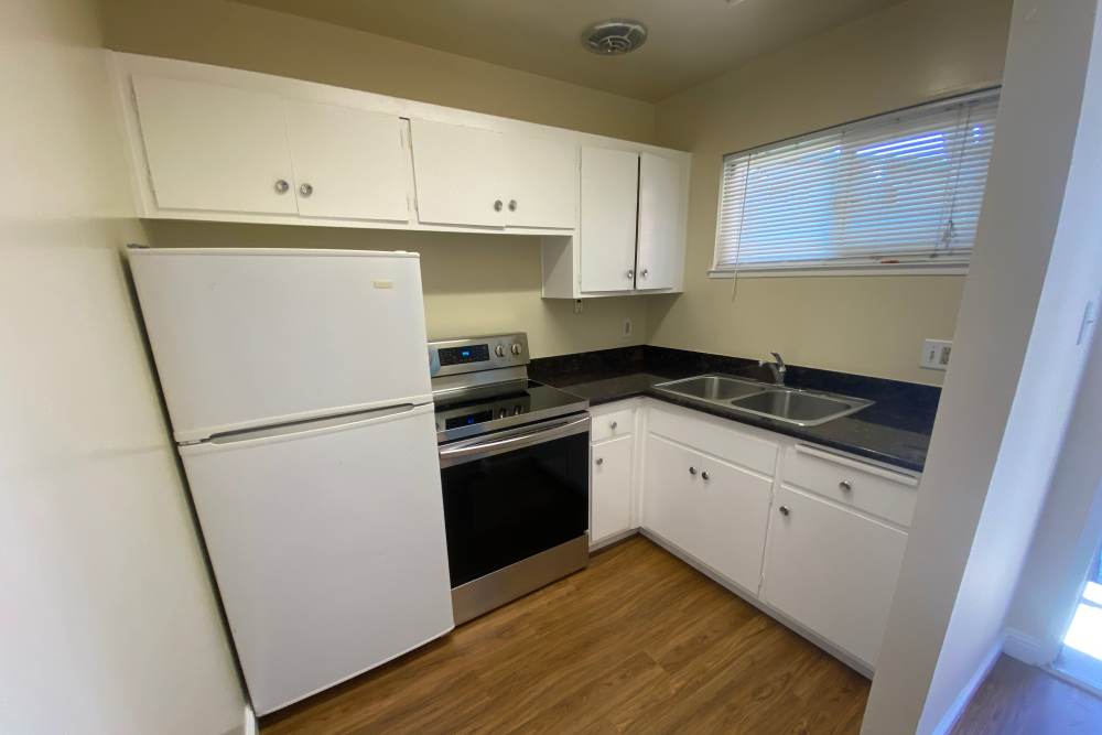 Kitchen with white cabinets at Terrace Garden Apartment Homes in San Leandro,California