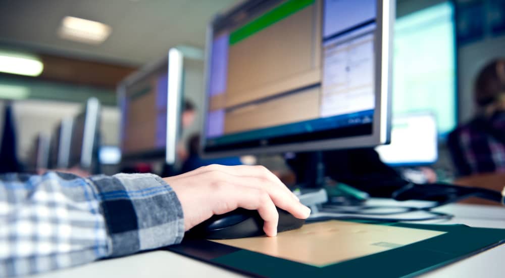 Resident using high-speed internet access facility at Terraces at Suwanee Gateway in Suwanee, Georgia