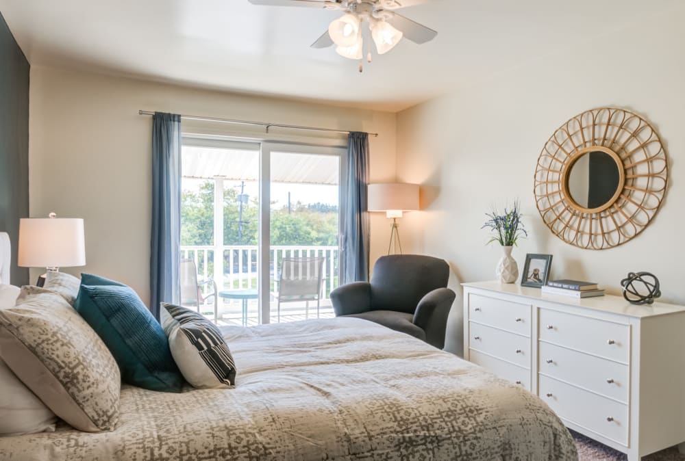 Model bedroom with a ceiling fan at Greentree Village Townhomes in Lebanon, Pennsylvania