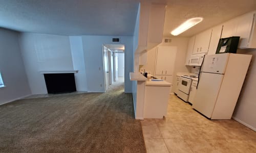 Living room and kitchen in a unit at Pickwick Place in Oklahoma City, Oklahoma