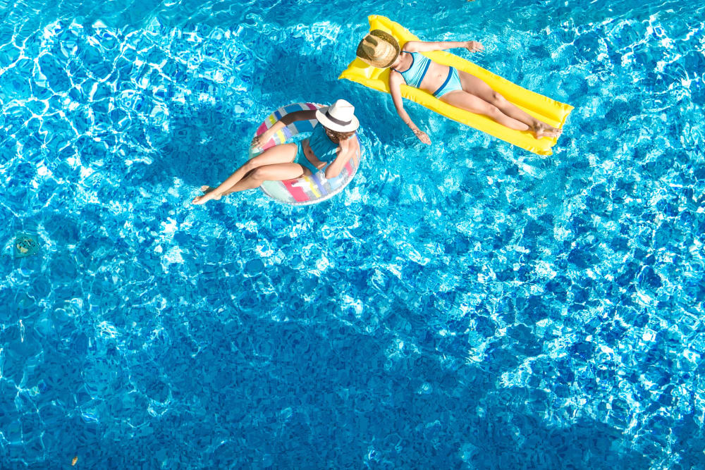 Residents enjoying a day at the pool at Eighteen51 Brinker in Denton, Texas