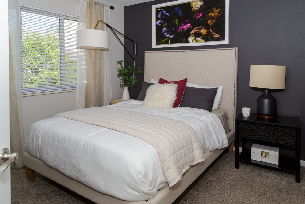 A spacious bedroom with plush carpeting at Metro on 5th in Saint Charles, Missouri