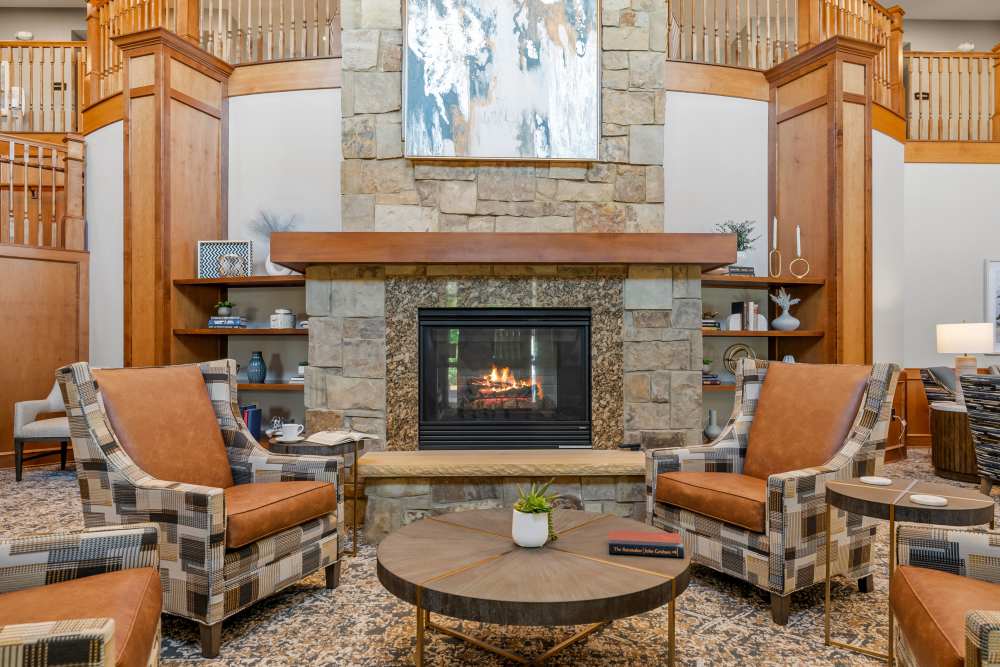 Lobby with fireplace at Amira Choice Roseville in Roseville, Minnesota