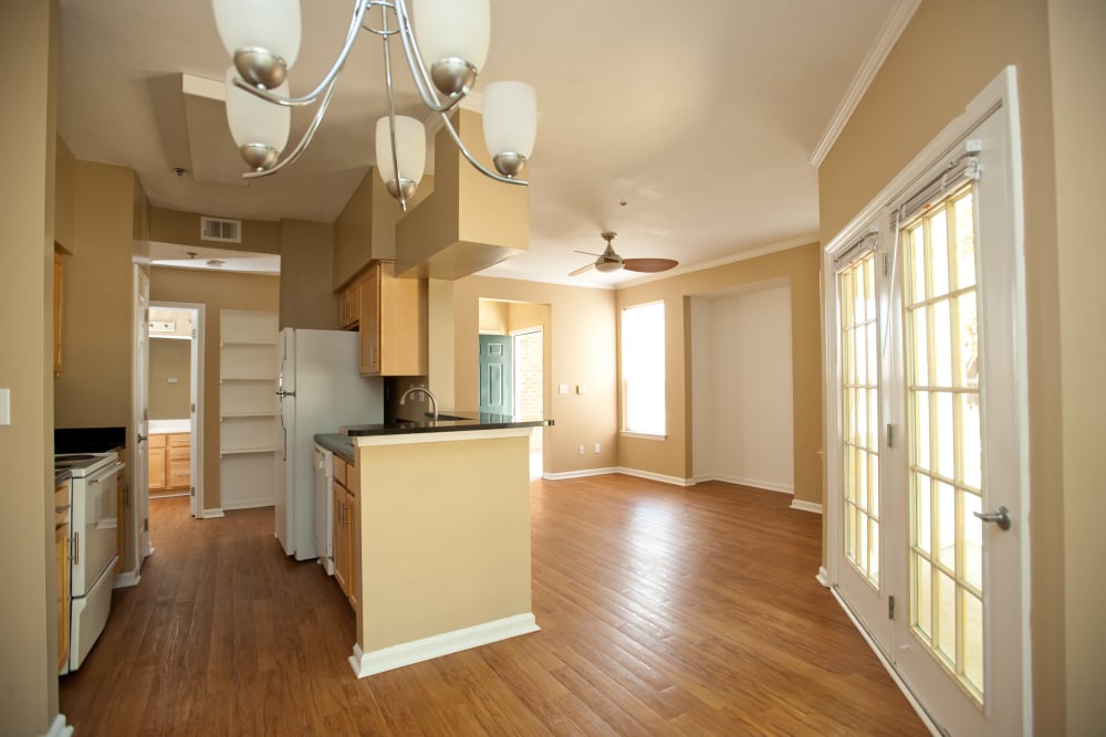 Kitchen and living room with hardwood flooring at Beaumont Farms Apartments in Lexington, Kentucky