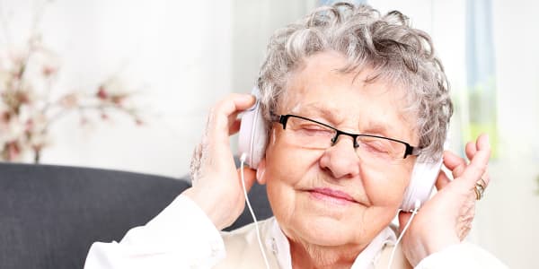 Resident listening to music at The Residences on Forest Lane in Montello, Wisconsin