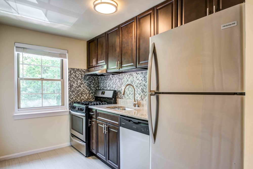 This spacious kitchen at Haven New Providence in New Providence, New Jerseyfeatures ample cabinet storage space