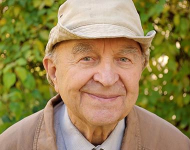 Male resident smiling at Mirror Lake Village Senior Living Community in Federal Way, Washington.