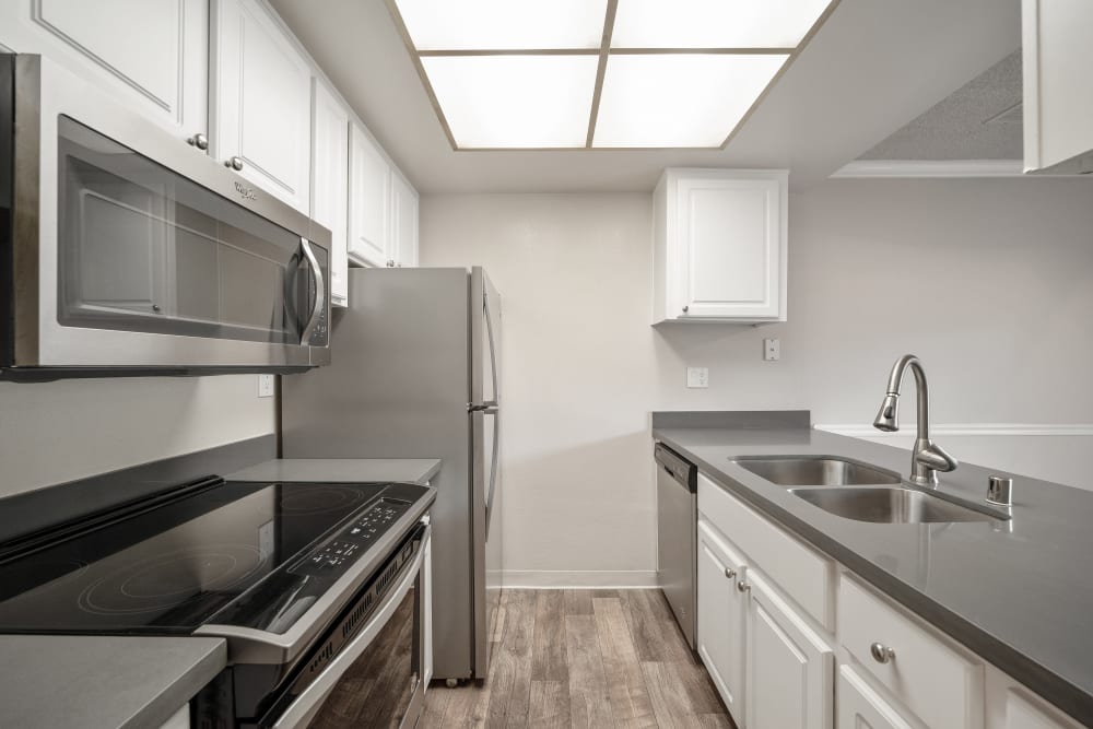 A large kitchen with white appliances at Valley Ridge Apartment Homes in Martinez, California