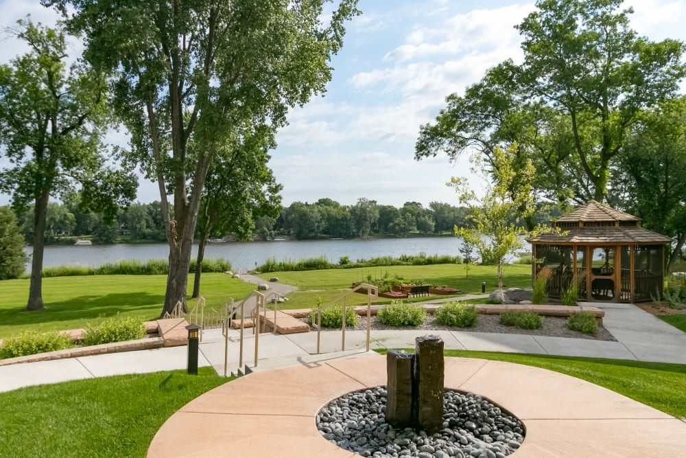 Fountain and river view at Applewood Pointe of Champlin in Champlin, Minnesota. 