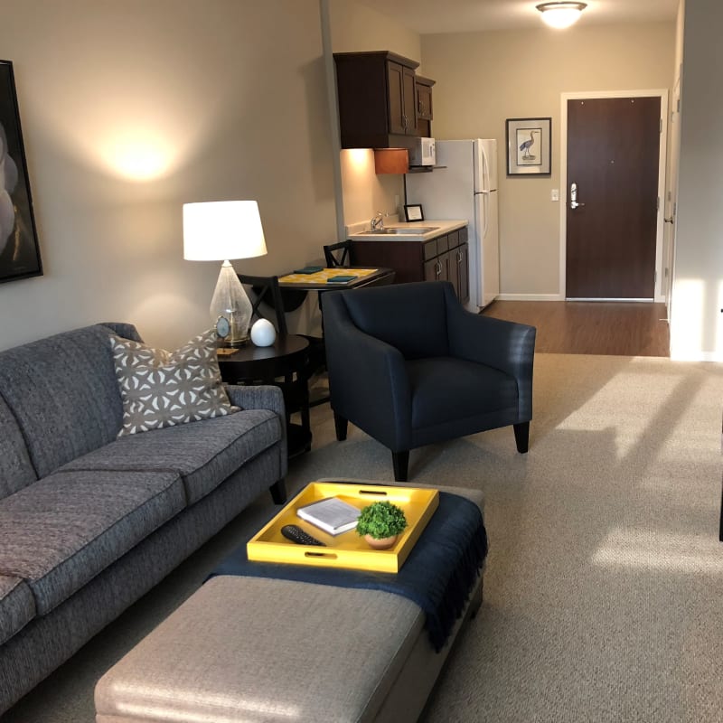 Modern living room and kitchenettes offered at The Sanctuary at Brooklyn Center in Brooklyn Center, Minnesota