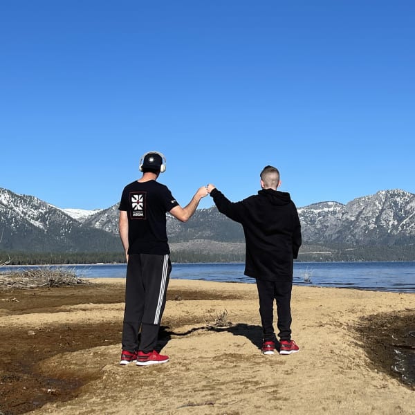 fist bump at a lake