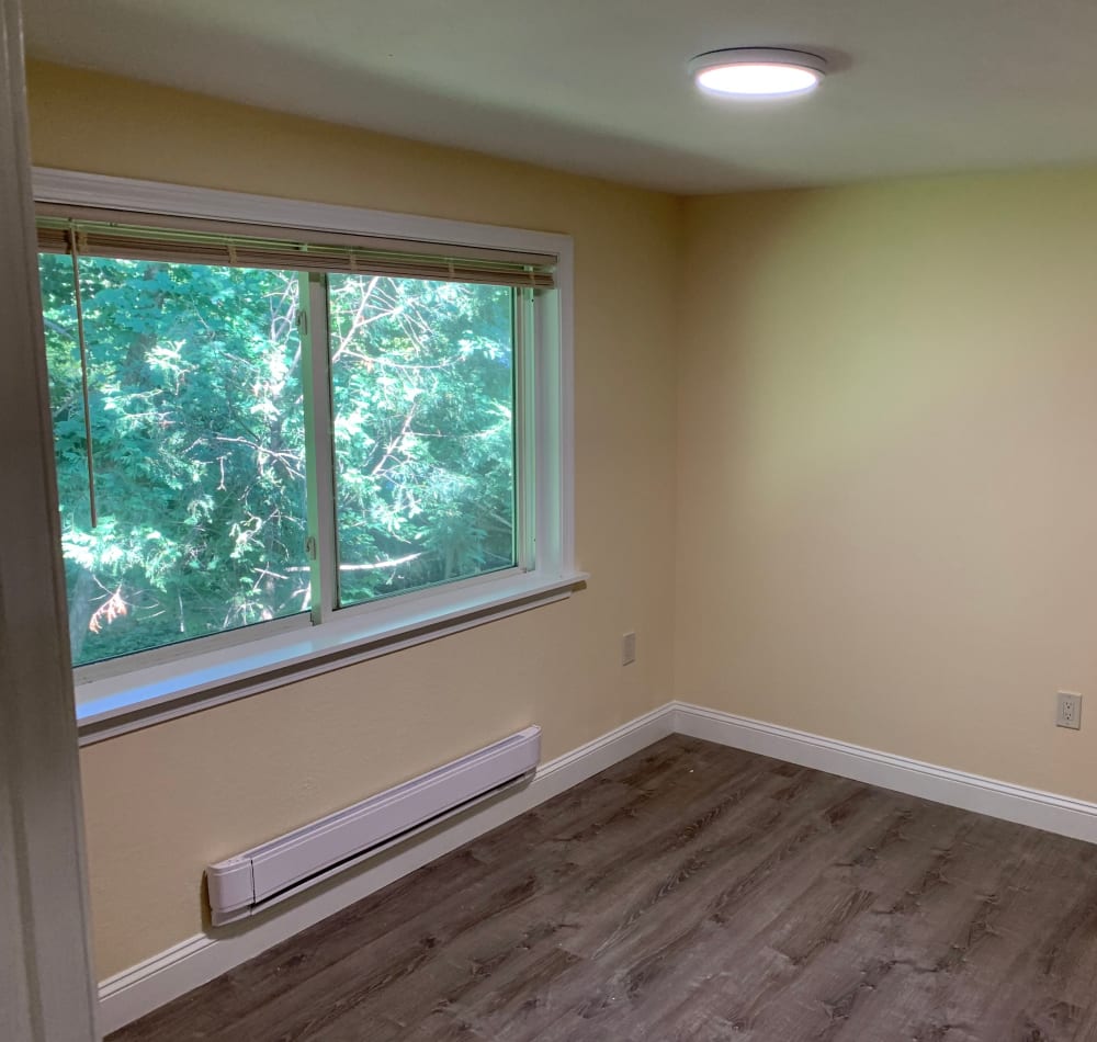 spacious bedroom with large windows at Fox Park Apartments in Plymouth, New Hampshire