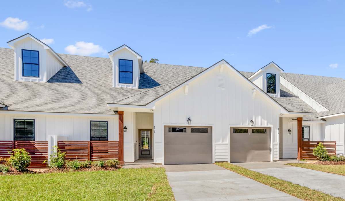 Exterior with driveway at Cottages at Sugar Mill Pond in Youngsville, Louisiana