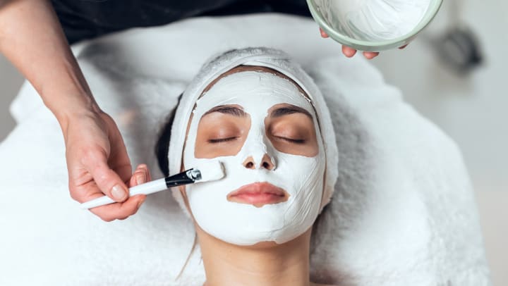 A woman getting a face mask at a spa │ facial spas near Meridian