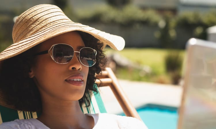 Resident enjoying her day at the pool at Town Court in West Bloomfield, Michigan