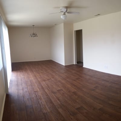 Open living room with wood flooring at San Miguel in Point Mugu, California