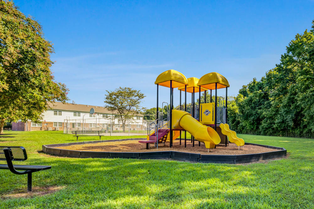 Kids playing on a playground at City Line Apartments in Newport News, Virginia