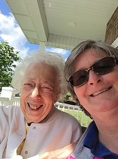 Happy resident and caregiver