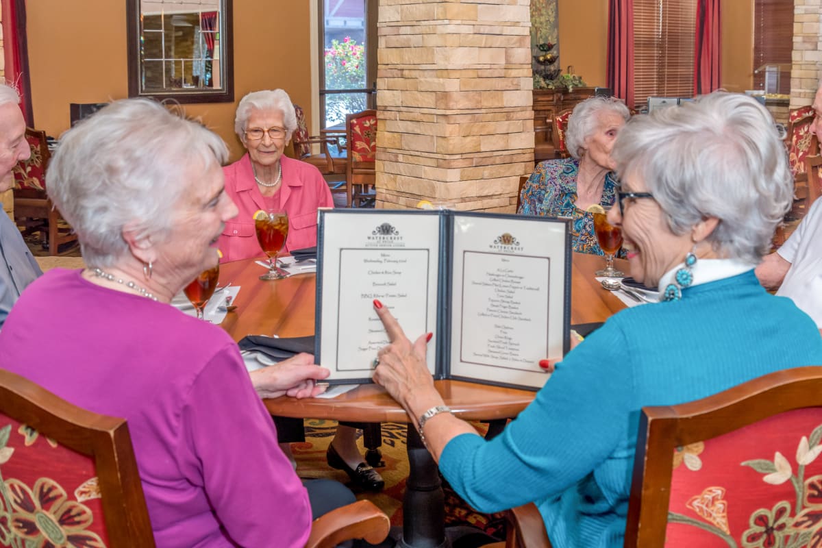 Residents saying cheers at The Landing at Stone Oak in San Antonio, Texas