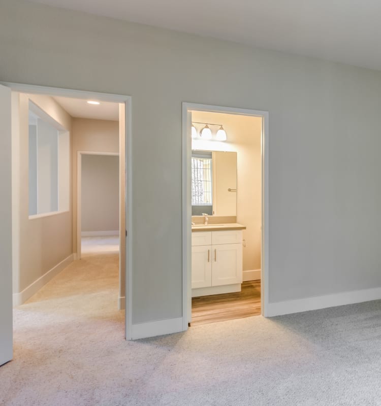 View of the hallway and en suite bathroom from a model home's bedroom at Sofi Westview in San Diego, California