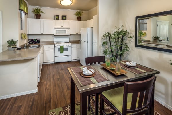 Model living room next to breakfast bar at Stone Oaks in Chandler, Arizona