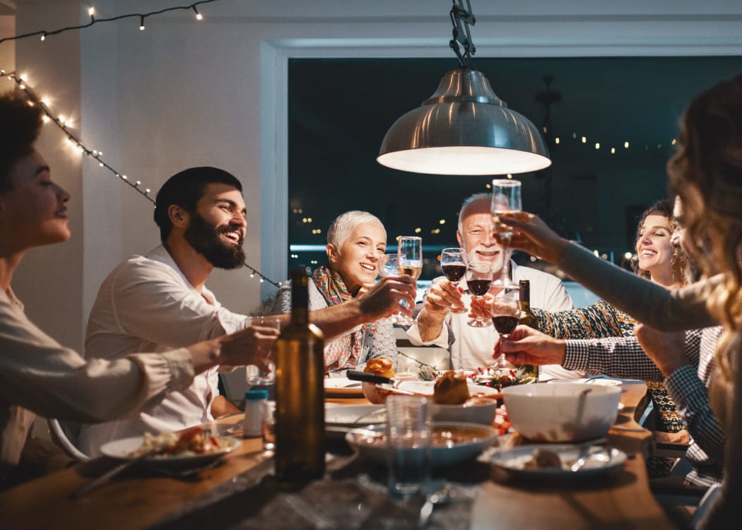 Residents enjoying a dinner party at Tuscany Hills at Nickel Creek in Tulsa, Oklahoma