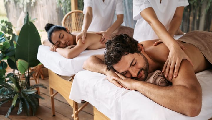 man and woman receive couples massage | best spas near Albuquerque