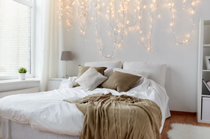 white bed and brown pillows and bedsheet