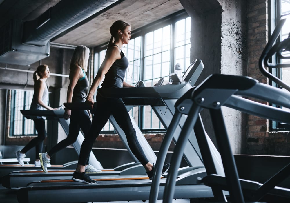 Residents staying in shape in the fitness center at TwentyTwenty Apartments in Portland, Oregon