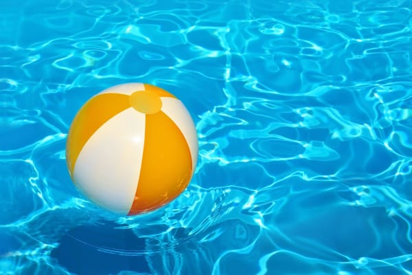 Ball floating in the pool at Parkside Towns in Richardson, Texas
