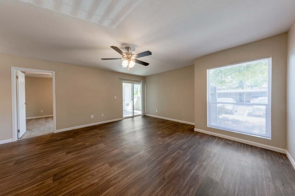 Spacious living room with ceiling fan at The Lodge at McCarran Ranch Apartment Homes in Reno, Nevada