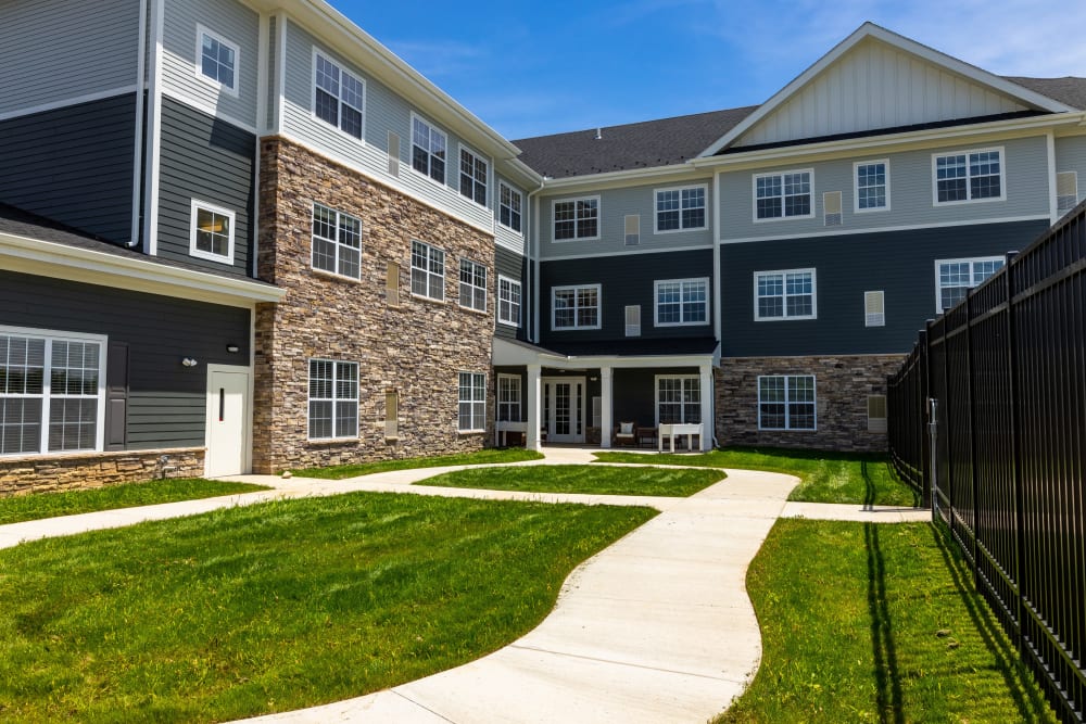 A paved walkway through a courtyard at Harmony at State College in State College, Pennsylvania