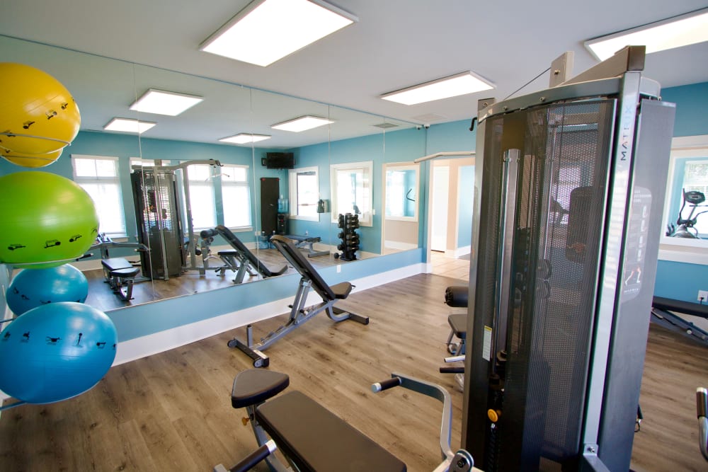 Weight room with exercise equipment at Greenbrier Woods Apartments in Chesapeake Virginia