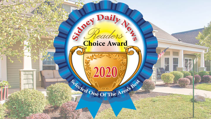 Sidney Readers choice award clip art on background of community exterior image