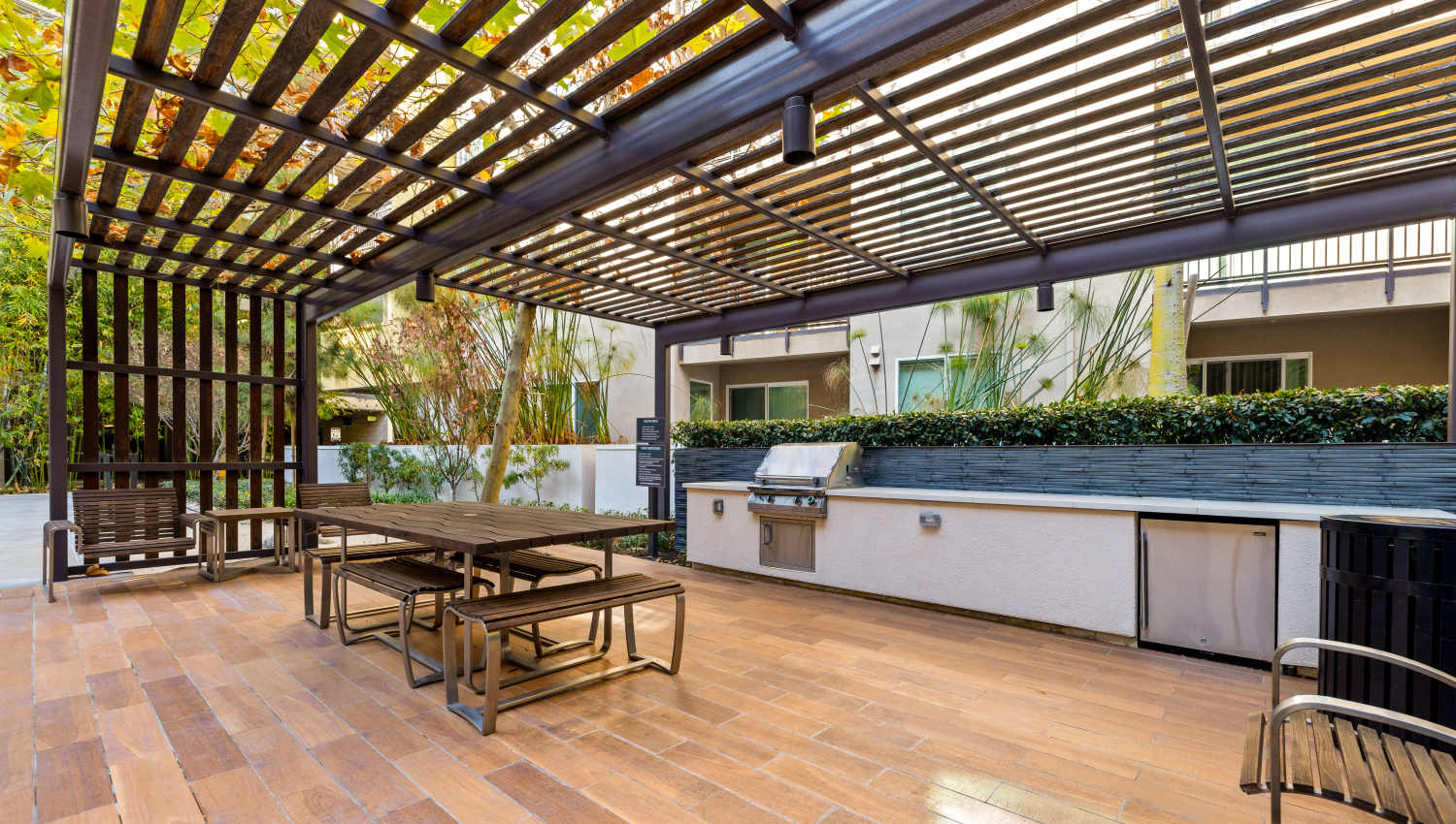 Pergola over a picnic table at one of the common area courtyards at Fusion Apartments in Irvine, California